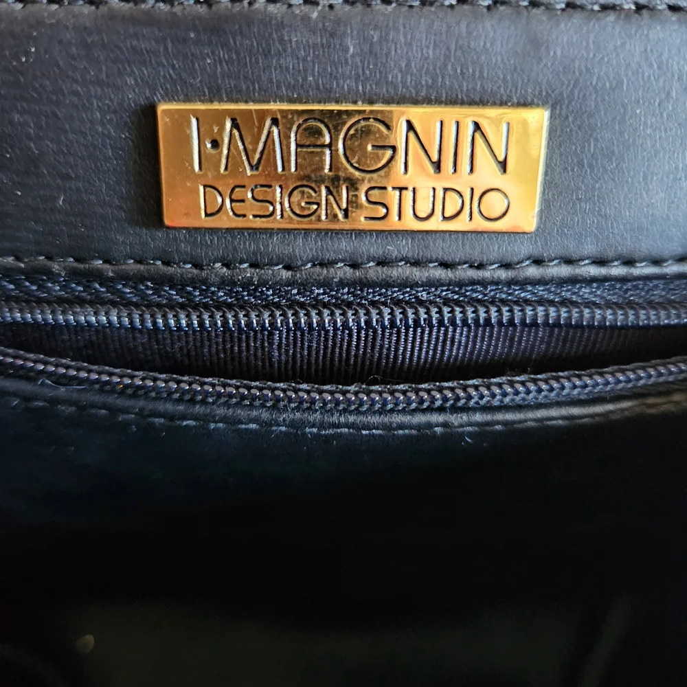 Elegant Black Shoulder Bag with Gold Accents